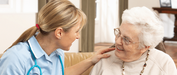 nurse talking with elderly woman
